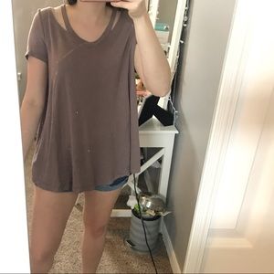 Boutique top with “worn” neckline.